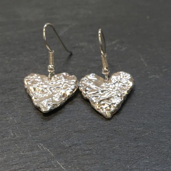 Sterling silver heart shaped drop earrings, formed by fusing and reticulating to give a lovely deep texture. Sterling silver jewellery designed and handmade by Carol James of Silverfish Designs.