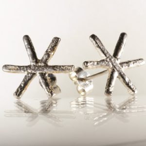 Tiny silver snowflake studs, designed and created by Carol James of Silverfish Designs